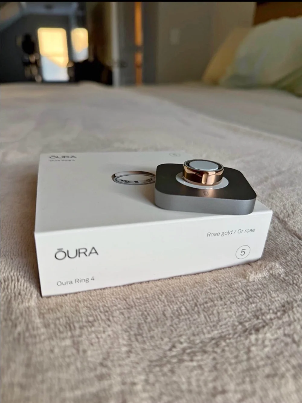 Oura Rose Gold Ring 4 with Silver Charging Dock